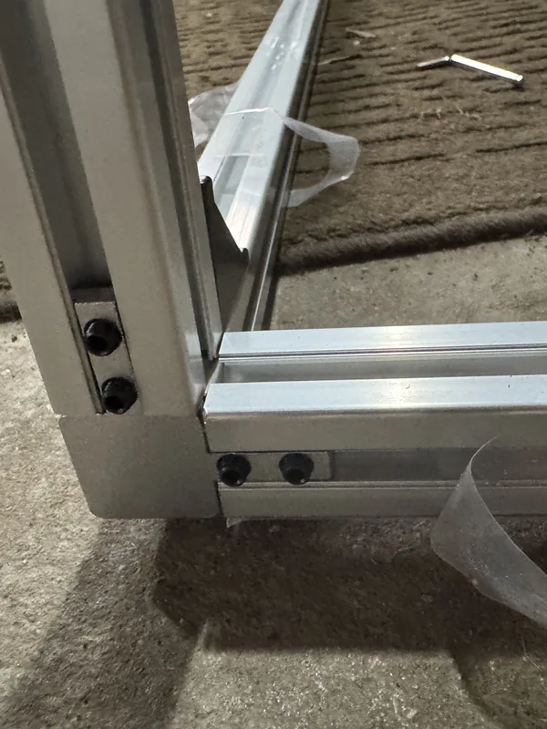 Close-up of an aluminum frame corner bolted together
